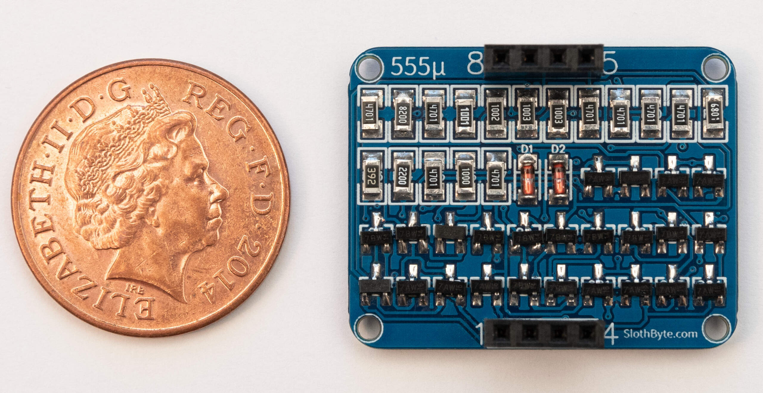 555 Micro next to 2p for scale